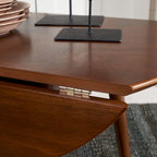 Tavolo rotondo pieghevole da pranzo, design salvaspazio, finitura in legno